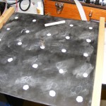 The game board, empty, with the detector and some chalk